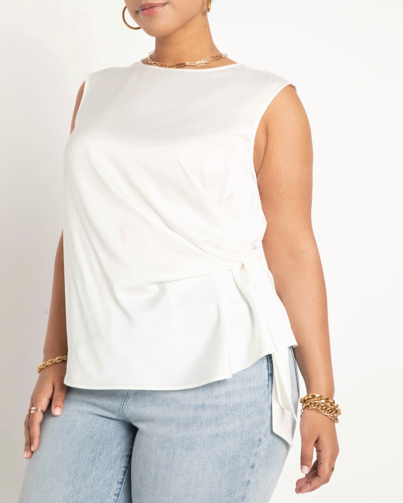 Front of a model wearing a size 14 Aria Tie Side Satin Tank in Cream White by ELOQUII. | dia_product_style_image_id:206672